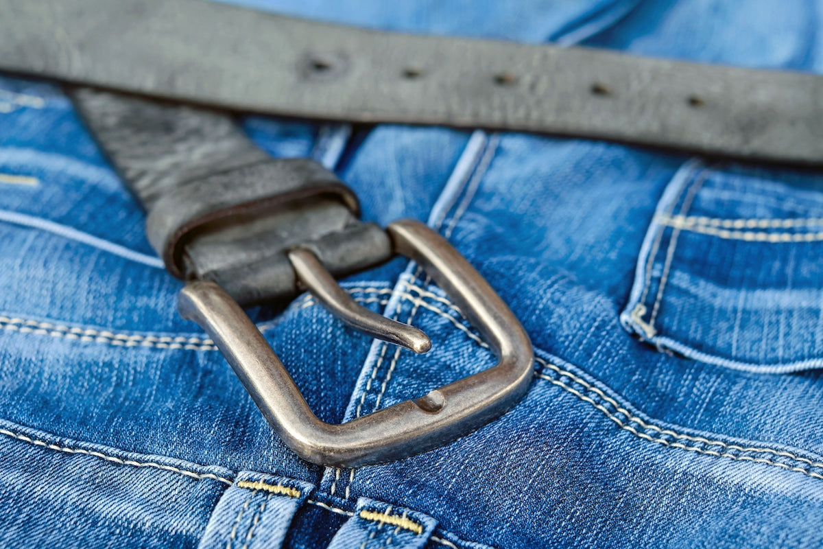 blue denim jeans with brown leather belt