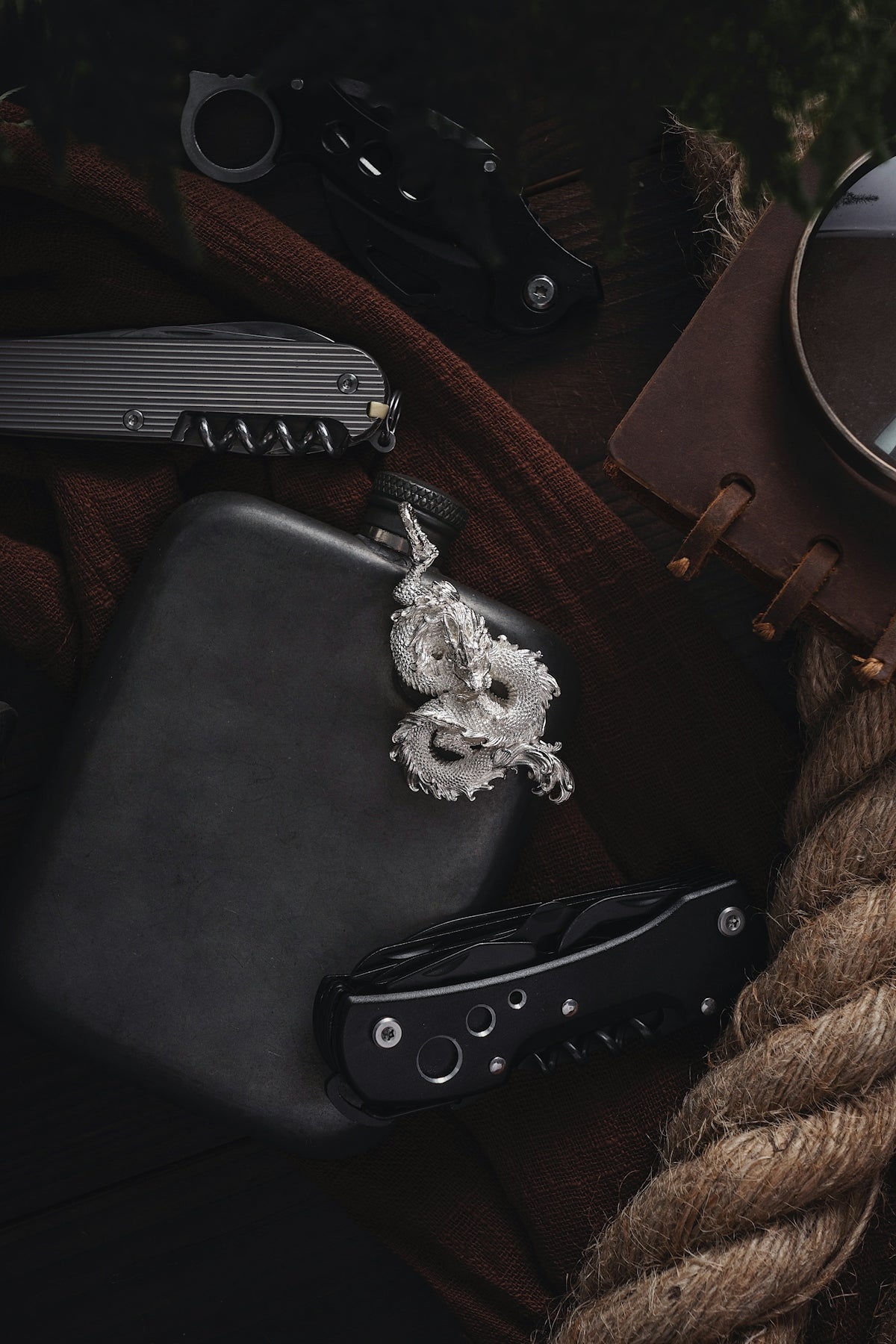 a knife, knife case, and other items on a table