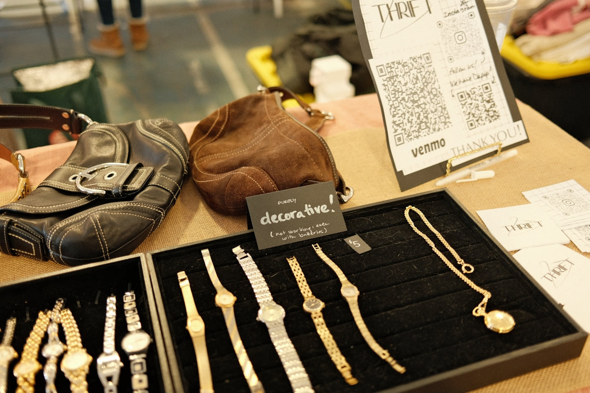 a table with a bunch of jewelry on it