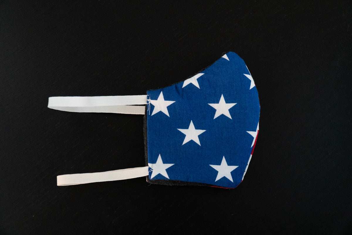 face mask with blue fabric and white stars patriotic design