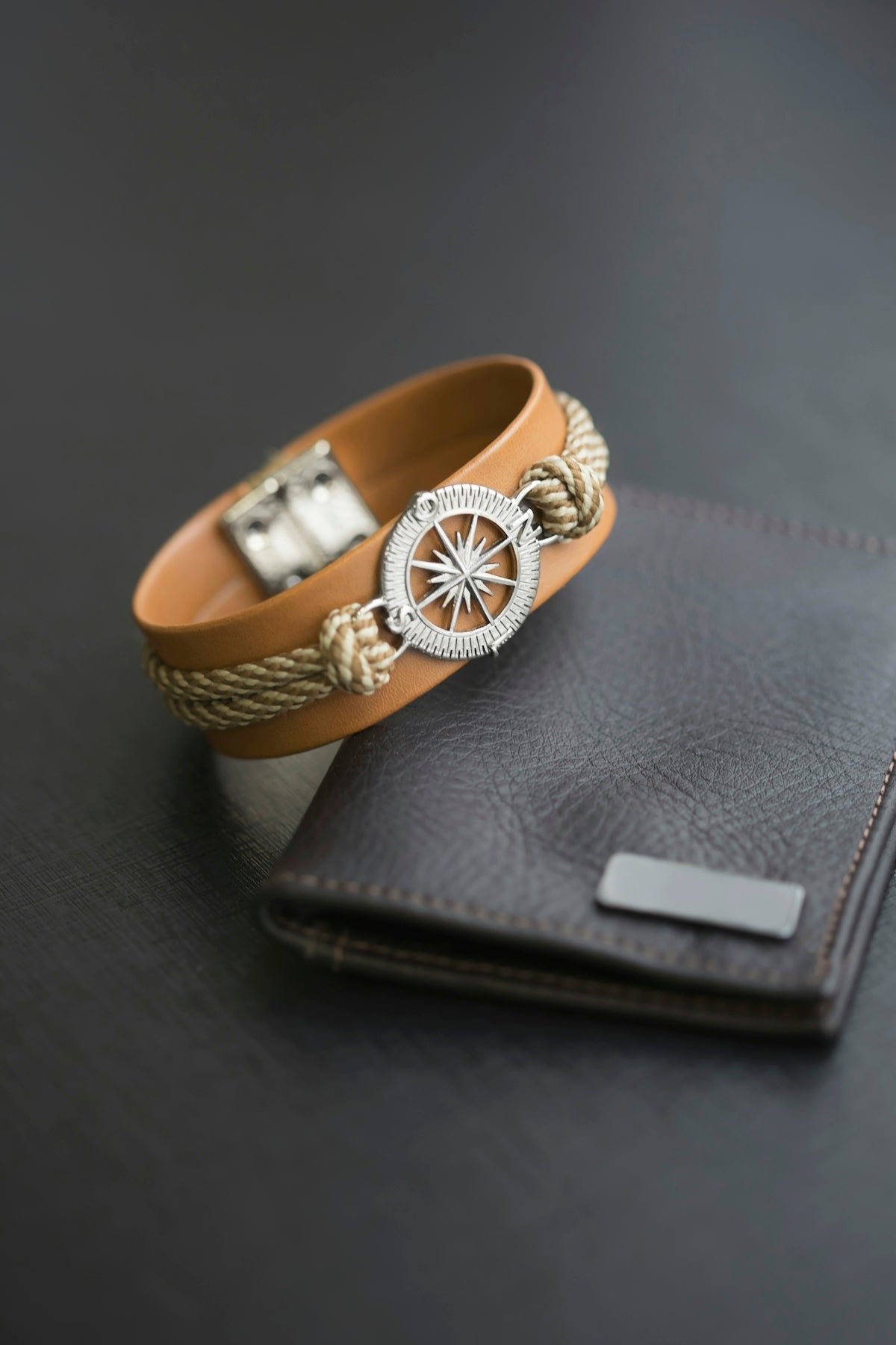 a gold ring on a black wallet