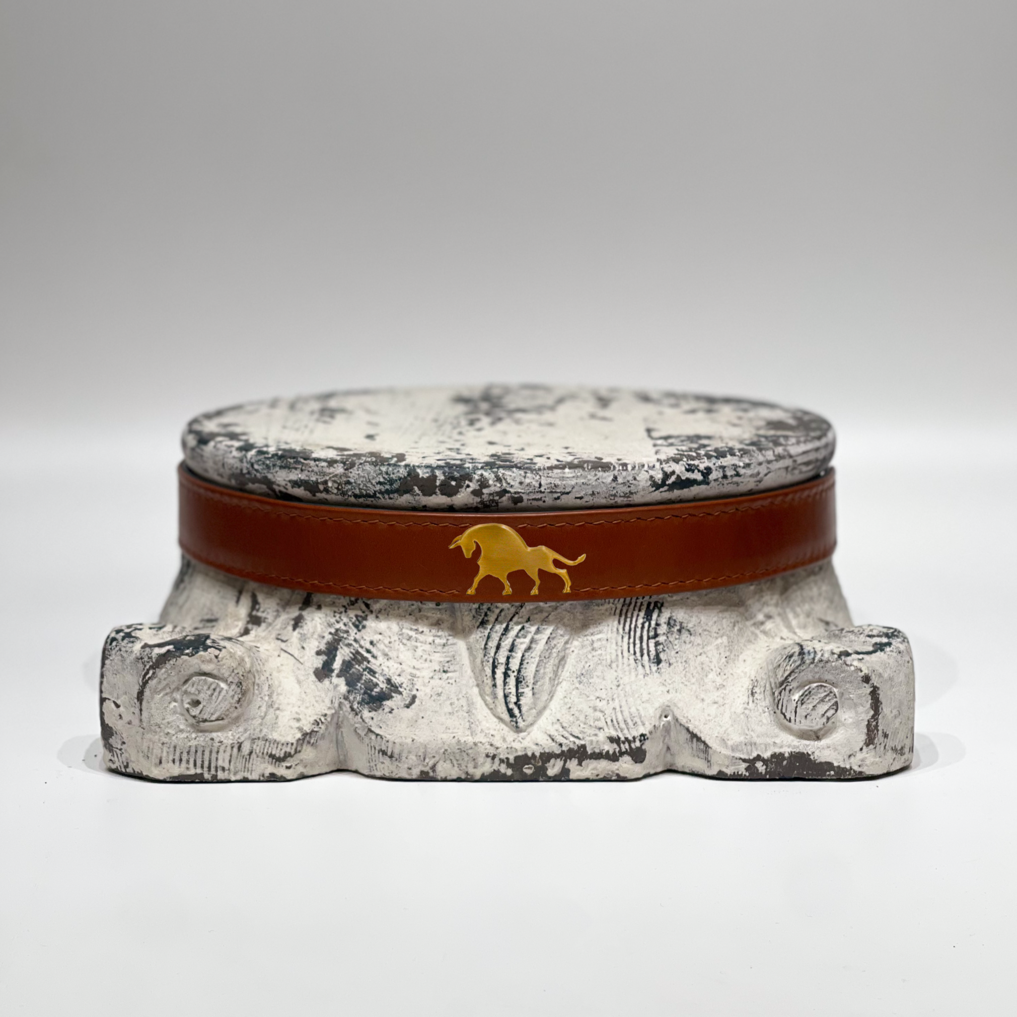 Bos Belt Hazelnut leather belt with brass horse buckle on vintage stone pedestal